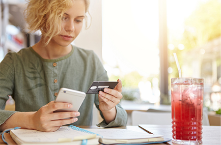 a woman paying a bill online